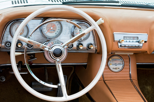 dashboard and steering wheel of a vintage convertible car