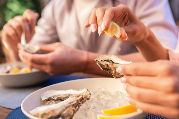 istock Young couple visiting restaurant of seafood 997945166