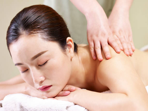 istock young asian woman enjoying body massage 997955886