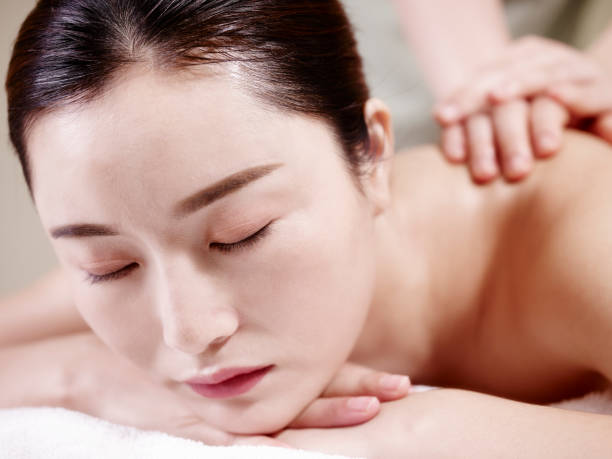 istock young asian woman enjoying body massage 997955914