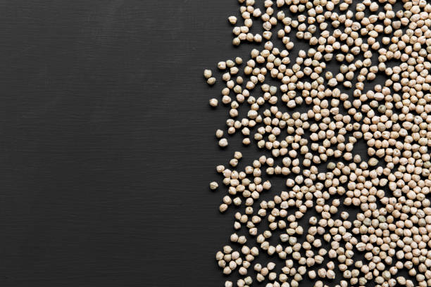 istock Dried chickpeas on a black background, top view. Copy space and text area. 997965106