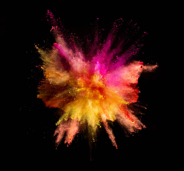 istock Explosion of coloured powder on black background 997968666
