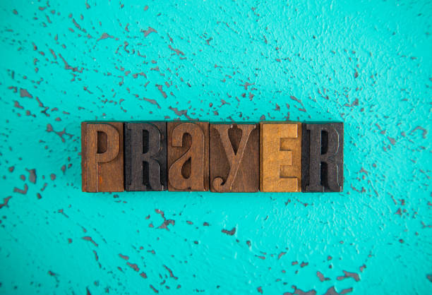 istock Prayer Spelled in Wooden Type Set Block Letters 997991312