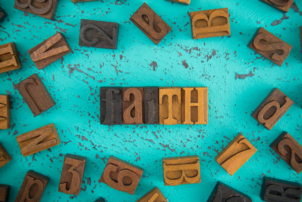istock Faith Spelled in Wooden Type Set Block Letters 997991922