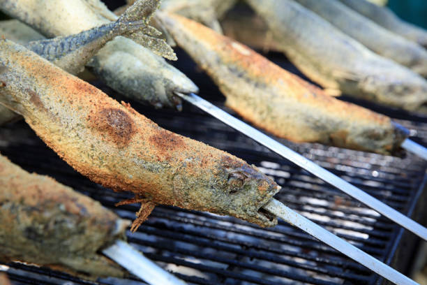 istock Fresh Mackerel on Stick at Barbecue Party. Germany 997994558