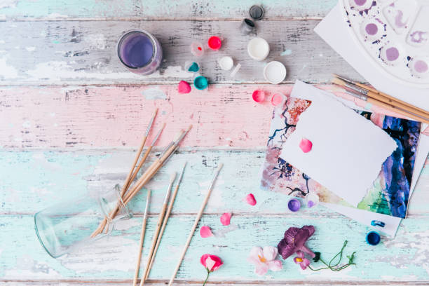 istock Artistic workspace, Brushes, paints, watercolor and a palette. Top view, flat lay. 998007810