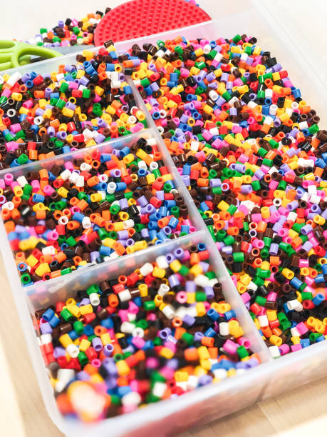 istock Multicolor beeds in plastic container for kids art and craft project. 998037980