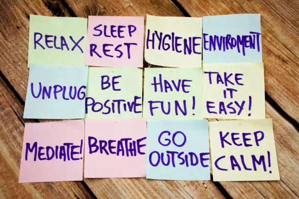 Health and positive handwritten notes on the papers with retro wooden background. Flat lay image of health handwritten notes. Sport and fitness positive handwritten messages.