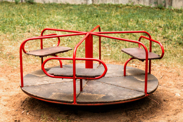istock Children's carousel in the park 998052778
