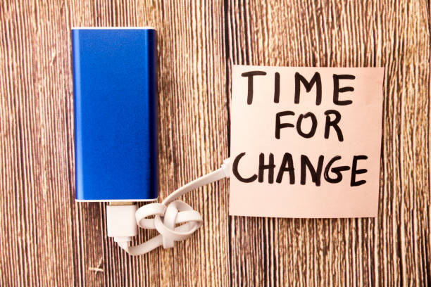 istock Motivational message for moving on with changes. Time for change motivational concept on white paper. Handwritten motivational messages. Wooden retro background. 998052838
