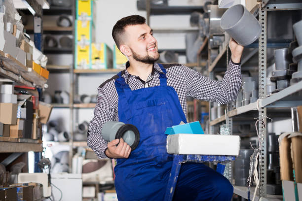 istock Male worker choosing drain pipe detail 998077518