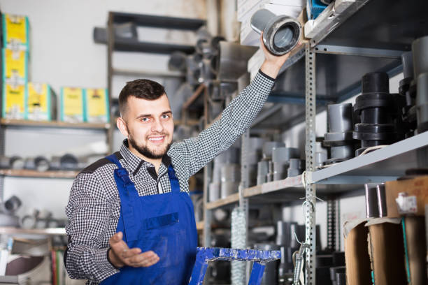 istock Worker demonstrates the choice of plastic pipes 998077522