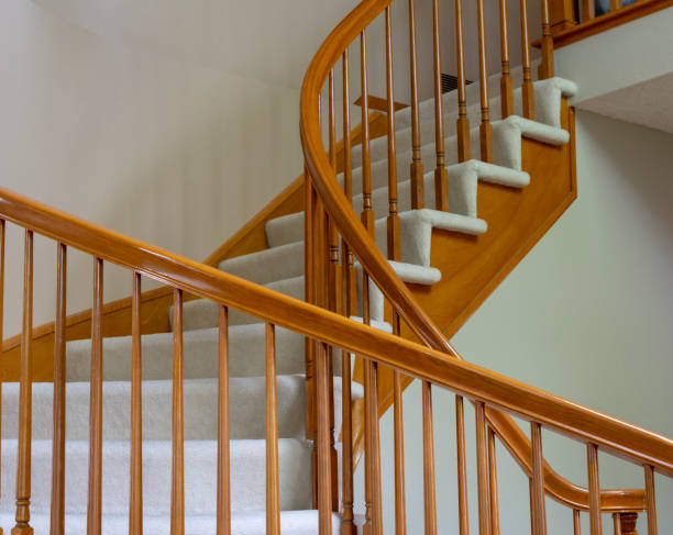 istock Wooden Staircase With White Carpet 998078270