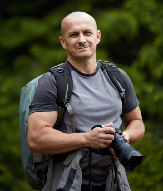 istock Photographer with camera outdoor 998078396