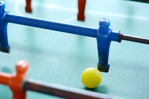 istock Soccer table game, blue foosball player. 998081132
