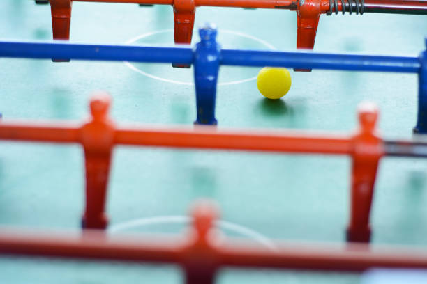 istock Soccer table game, blue foosball player. 998081148