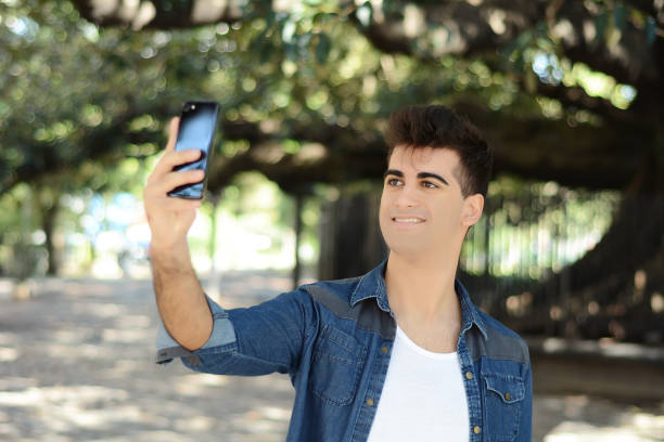 istock Happy young man taking a selfie. 998081268