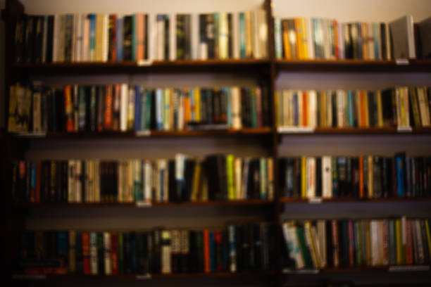 istock A large interior room home library with many diffirent books. Front view to wooden shelf filled with large number of books bookshelves concept image Blurred blurring not clear or distinct, hazy view. 998098286