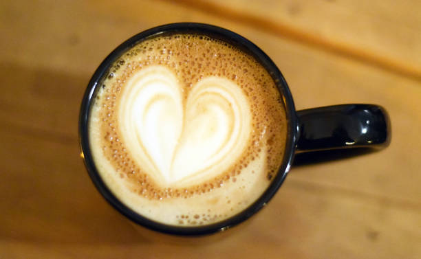 istock Cup of cappuccino with beautiful heart design 998101188