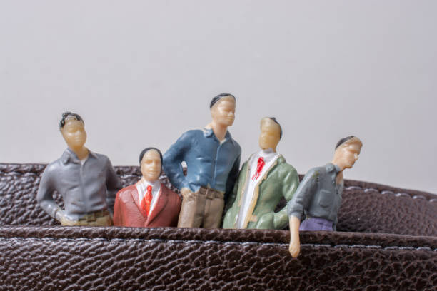 istock Tiny figurine of men model  in pockets 998106190