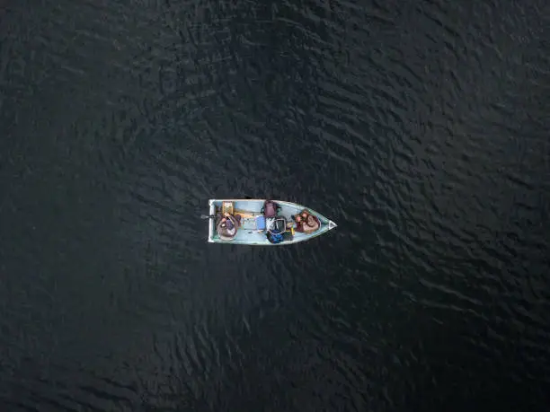 Photo of Aerial View of Fishermans Fishing From a Boat on Lake