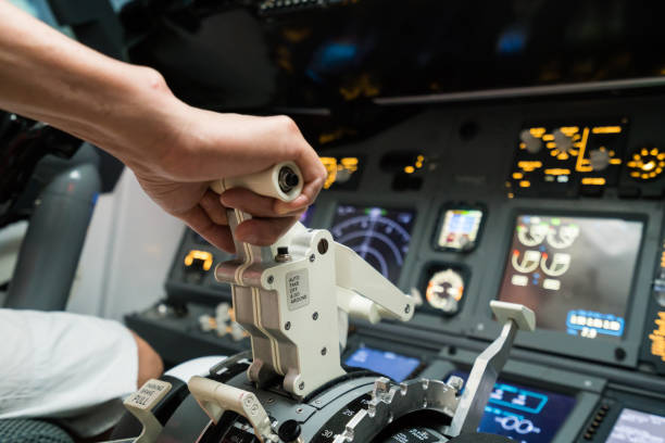 pilot pushing buttons in the cockpit - airplane cockpit taking off pilot imagens e fotografias de stock