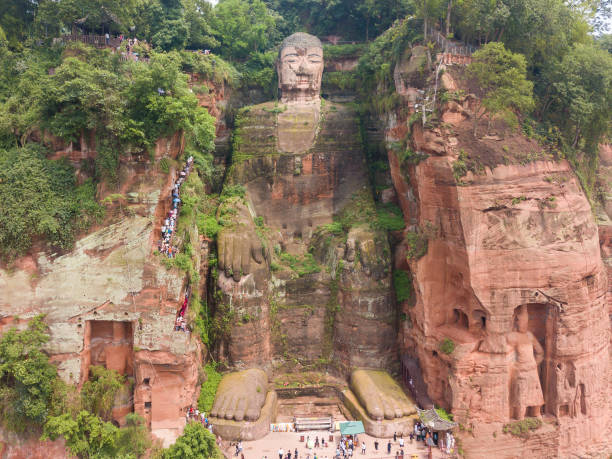 Chengdu, China - 21 May 2018: Tourists visited the Leshan Giant Buddha, it is a 71-metre tall stone statue, built during the Tang Dynasty and Each side of the the cliff is guarded by Buddha's god protector.