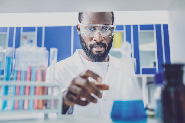 istock Bearded dark-hared physician taking test tube 998169146