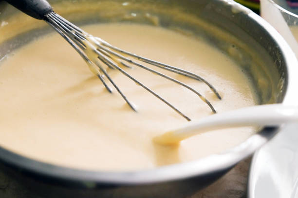 istock Mixing batter or dough for pancake or making desserts.Close up ,soft focus 998185932
