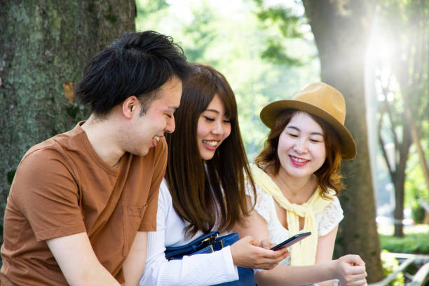 istock Friends are talking on a street in summer 998233562