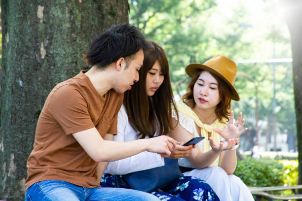istock Friends are talking on a street in summer 998234084