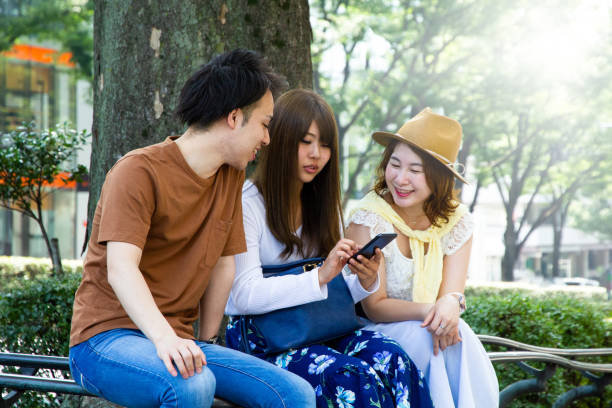 istock Friends are talking on a street in summer 998234092