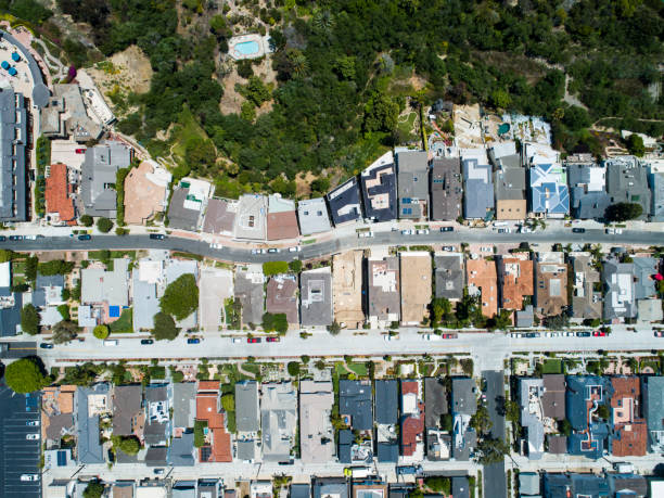 istock Aerial view of residential district with forest 998234704