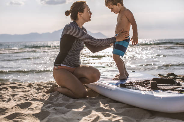 istock Mother and son on a paddle board 998238144