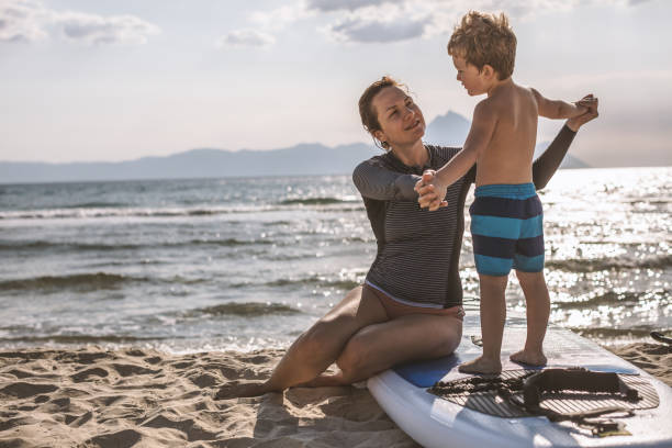 istock Surfing Lessons for my little one 998241090