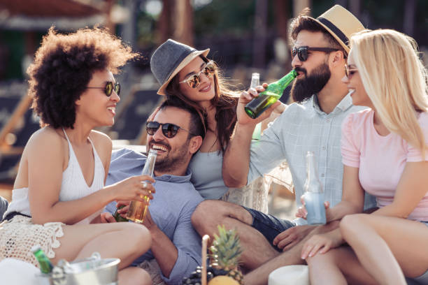 istock Cheerful young friends having fun on the beach 998242246
