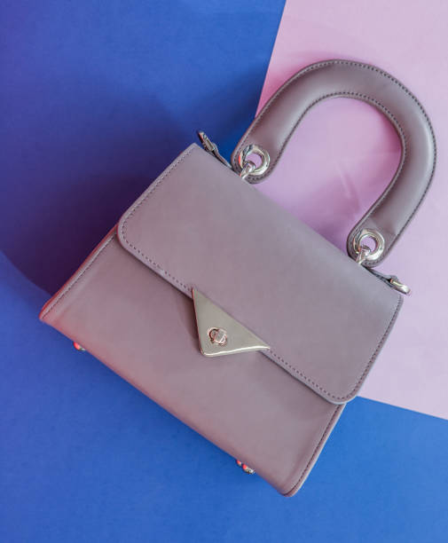 istock Fashion grey bag on the blue background 998253484