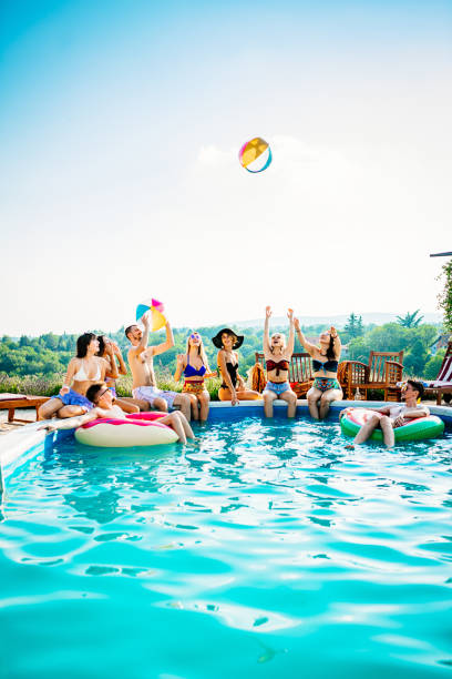 pool party for young people - swimming pool party summer beach ball imagens e fotografias de stock