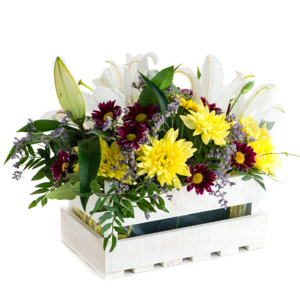 istock Gift box with fresh lily flowers and chrysanthemum isolated on w 998274908