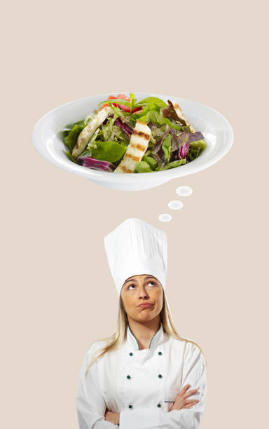istock Female chef thinking of a salad 998275294