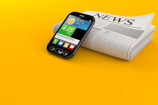 istock Newspaper with smart phone 998275348