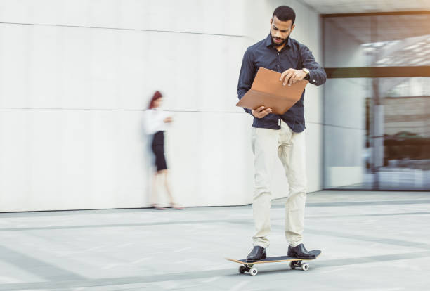 istock Businessman on a Skateboard 998279620
