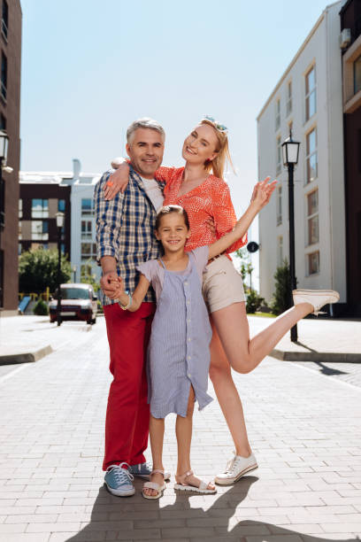 istock Delighted happy family looking at you 998285392