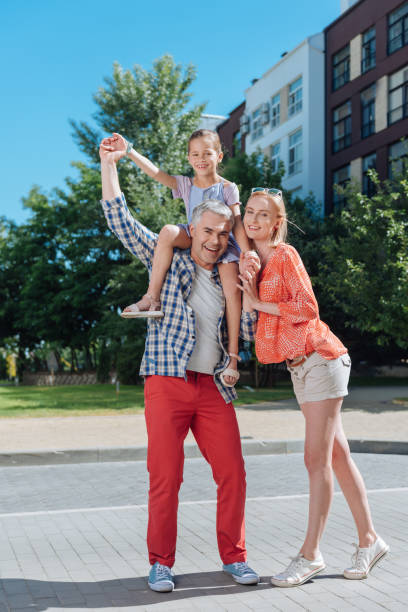 istock Nice joyful family standing together 998285562