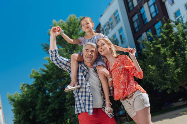 istock Cheerful happy family enjoying their walk 998285590