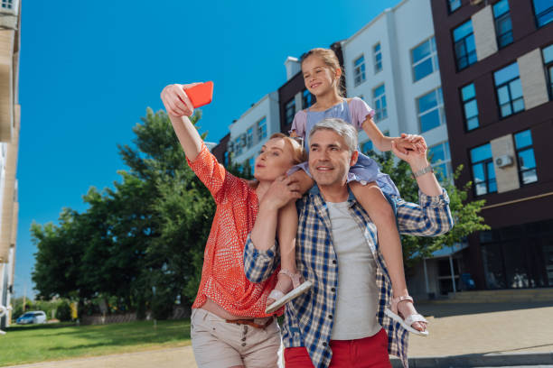 istock Nice positive woman taking a selfie 998285638