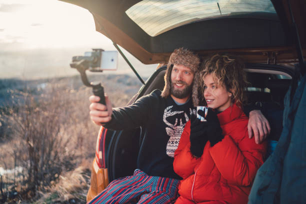 Hiking couple in mountain and vlogging