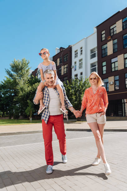 istock Delighted nice family having a walk together 998287802