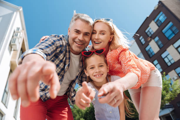 istock Happy nice family pointing at you 998288776