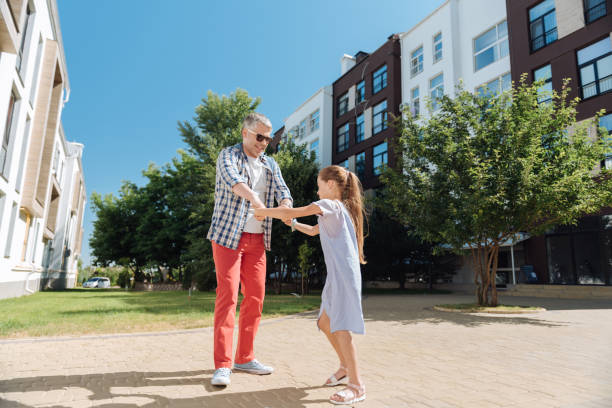 istock Joyful happy man playing with his daughter 998289016